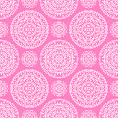 Vector seamless pattern with ethnic mandala. Tribal background with hand drawn doodle ornaments and hearts. On pink background. Colorful background for St. Valentine's Day.