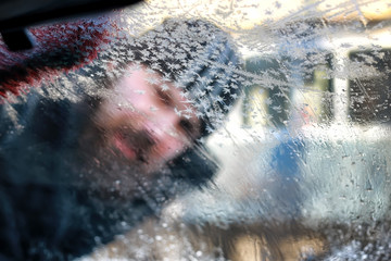 winter man brush car snow