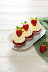Muffins red velvet with cheese cream and strawberry