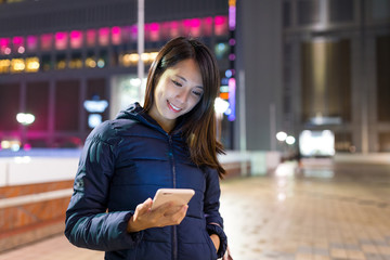 Fototapeta premium Woman sending sms on cellphone