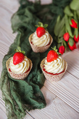 Muffins red velvet with cheese cream and strawberry
