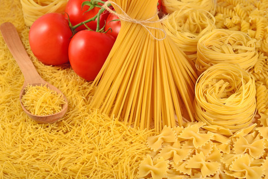 Italian pasta and ripe tomatoes branch