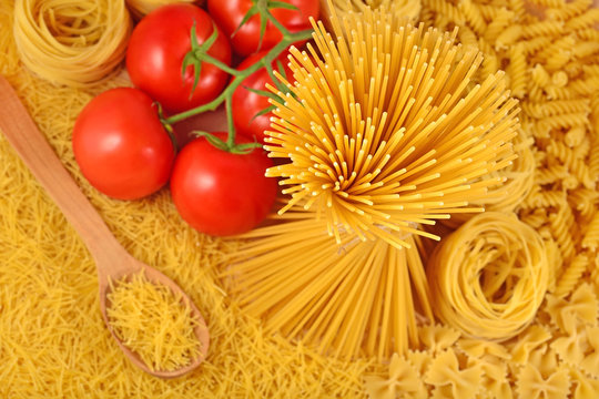 Italian pasta and ripe tomatoes branch