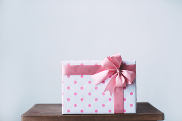 Gift with pink ribbon.