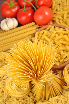 Italian pasta, ripe tomatoes branch and garlic
