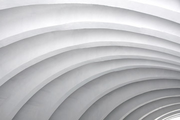 Architectural background. Modern white concrete arched ceiling in perspective. Same semicircular shape.