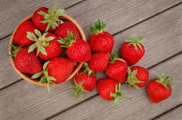 Strawberry in bowl on wooden