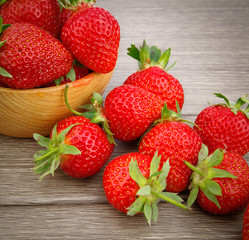 Strawberry in bowl on wooden