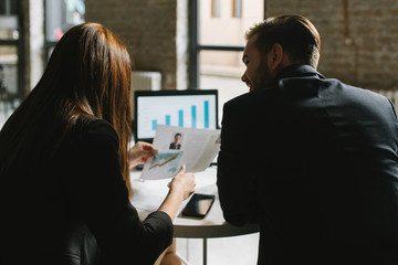 Two young people working in the office