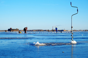winter fishing on the sea the bright sun