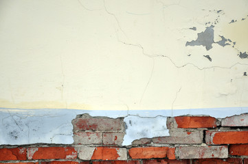 Red brick wall with white cracked plaster. Grunge texture with empty space.