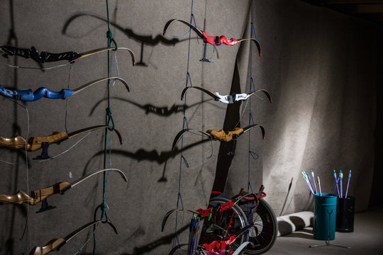 Bows And Arrows In An Indoor Archery Range - Archery Club