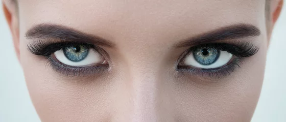 Foto op Plexiglas close-up face of pretty girl with beautiful big blue eyes, big eyelashes and eyebrows © tavrox