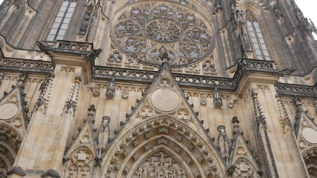 Metropolitan Cathedral of Saints Vitus Wenceslaus and Adalbert facade slow tilt 4K 2160p 30fps UltraHD footage - Gothic style church in Prague Czechia Czech Republic 3840X2160 UHD tiling video 