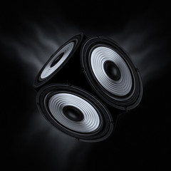 Concept of surround sound. Object with three audio speakers on black background.