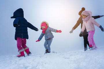  Four girls are having fun in the snow.