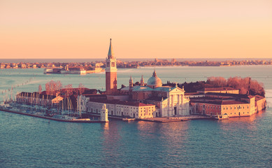 Fototapeta na wymiar Panoramic aerial cityscape of Venice,with rooftops, the sea at sunset, Veneto, Italy.