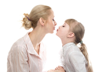  Beautiful blonde  mother and cheerful  daughter kissing