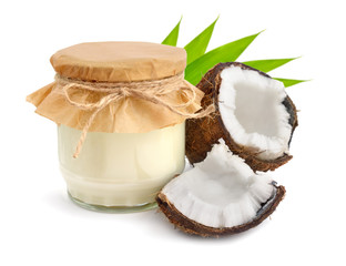 Fototapeta na wymiar Jar of coconut oil and fresh coconuts