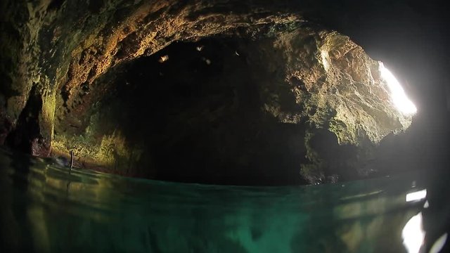 Split underwater shoot on the cave with bats. High level of noise, iso 800