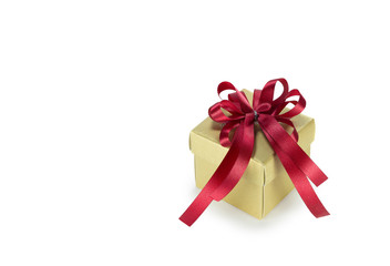 Gold gift box with red ribbon