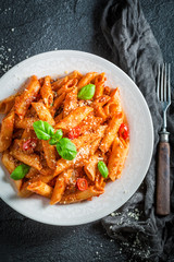 Tasty pasta bolognese with parmesan and basil