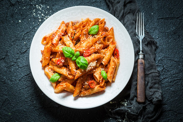 Delicious pasta bolognese with parmesan and basil
