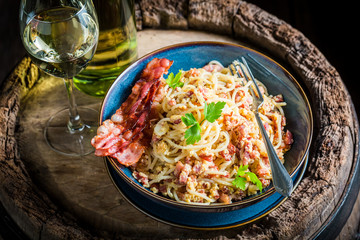 Enjoy your spaghetti Carborana with becon, parsley and eggs