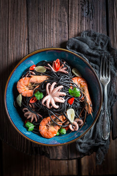 Fresh spaghetti with seafood with shrimp, octopus and parsley