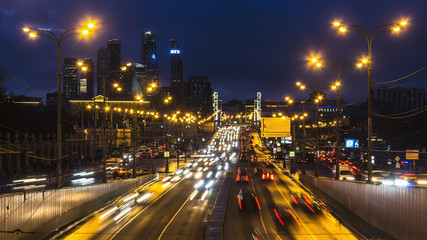 Fototapeta na wymiar night traffic on urban thoroughfare