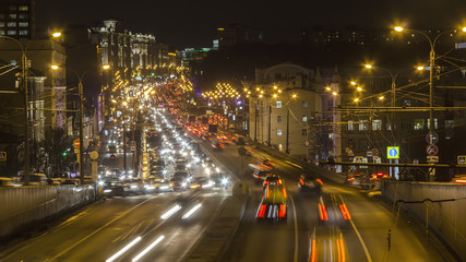 Fototapeta na wymiar night traffic on urban thoroughfare