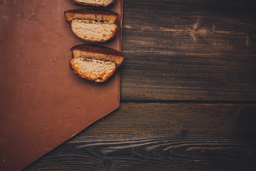 cut bread on a board, wooden background