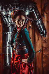 Naklejka premium A beautiful woman with the tied male robot.