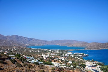 Obraz premium Elevated view of Elounda with views across the sea towards the island of Spinalonga, Elounda, Crete.