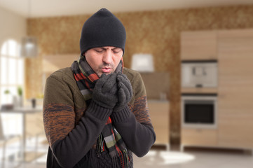 Young man feeling very cold