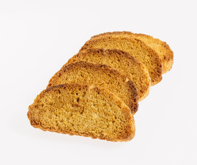 Pieces of dry bread on a white background.