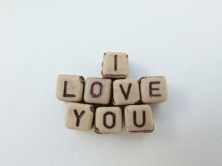 The phrase I LOVE YOU formed from cubes with letters