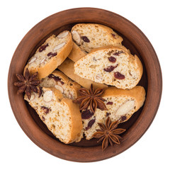 Cookies with raisins in a ceramic plate. Isolated on white backg