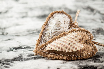 Heart made of cloth on wood desk