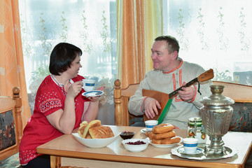 Playing the balalaika / The scene for the morning tea and play the balalaika