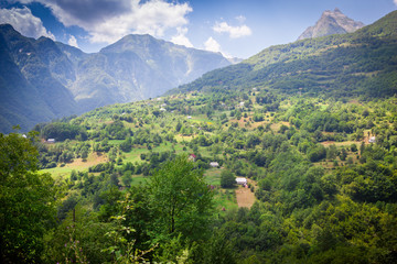 Fototapeta premium landscape of the mountains with a small farm
