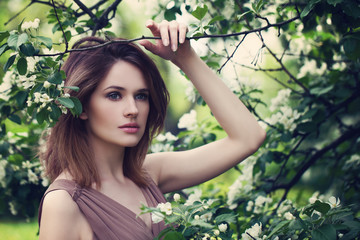 Pretty Woman in Apple Tree Flowers
