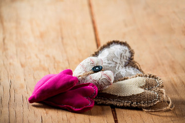 Heart made of cloth on wood desk