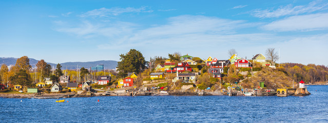 Panoramic view of colorful houses and cabins in Oslo islands - obrazy, fototapety, plakaty