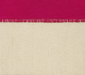 Red napkin on fabric background