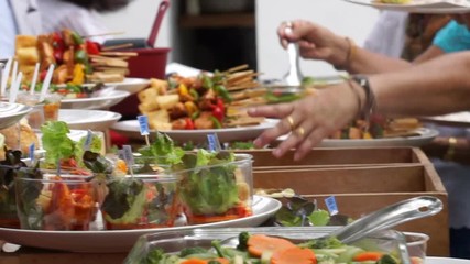 People grabs food from cocktail party in wedding ceremony