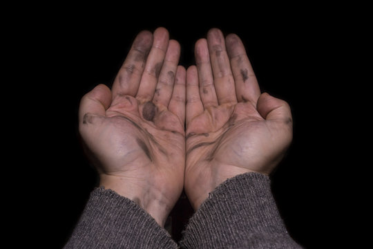 Dirty hands isolated on black