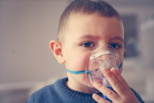 Little Boy Using Inhaler.