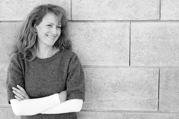 Portrait of smiling 40 years old woman outdoors