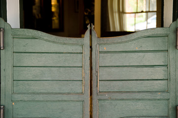 Old wooden saloon style doors at pub